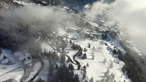 Flying Over Winding Winter Road – Liechtenstein Snowy Landscape 스톡 동영상 329557890