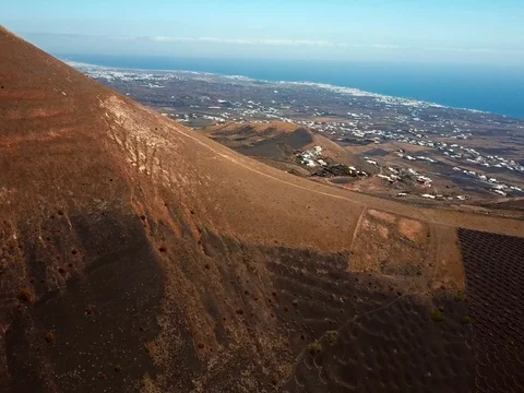 Flying over wine valley of La Geria, Lanzarote, Canary islands, Spain Stock Footage 75155385