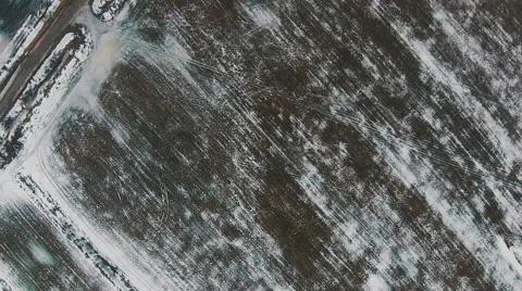 Flying Over Winter Agricultural Fields in Cloudy Weather Stock Footage 47459567