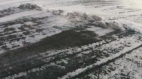 Flying Over Winter Agricultural Fields in Cloudy Weather Stock Footage 47460228
