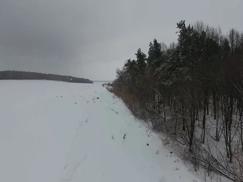 Flying over winter forest and the road Stock Footage 74053068
