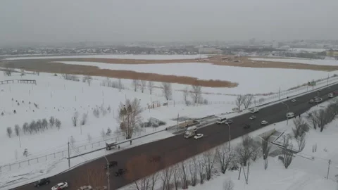 Flying over winter main road on the left bank of Irtysh river in center of Omsk Stock Footage 237805211