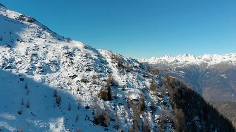 Flying over the winter Mountains in Alps Stock Footage 102289004