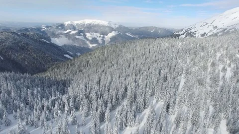 Flying over winter mountains in a magic sunny day Video stock 74259261