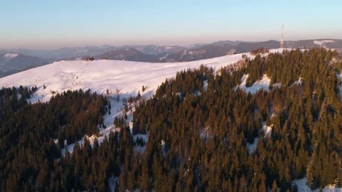 Flying over winterland, mountain snow covered winter landscape. Stock Footage