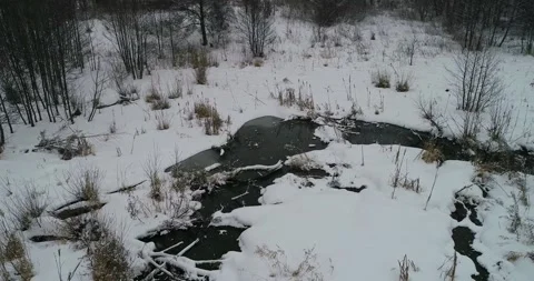 Flying over a wintet small river Stock Footage 147694083