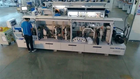 Flying over the workers who assemble the machine. The process of collecting the Stock Footage 111218993