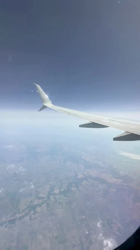 Flying Over the World from a Plane Window Stock Footage 316979799