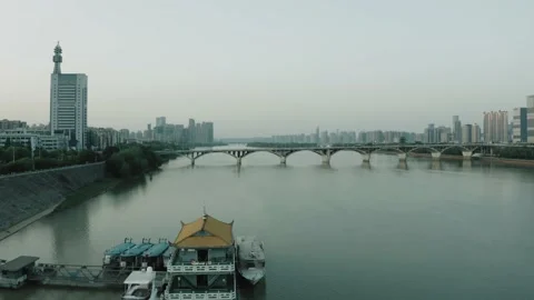 Flying over Xiang River towards Orange Island Bridge Stock Footage 167530464