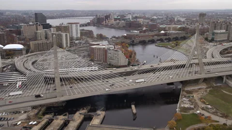 Flying over the Zakim Bunker Hill Bridge on the Charles River in Boston toward a Stock Footage