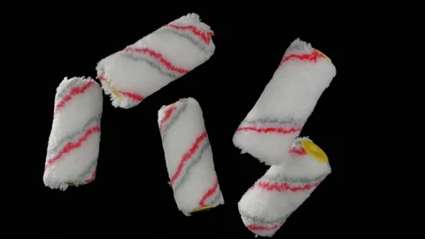 Flying paint rollers on a black background. Repair materials. Super slow motion. 스톡 동영상 149217398