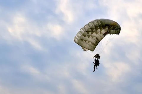 Flying parachute with cloudy sky 库存照片