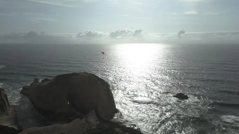 Flying Paraglider Over Cape Kiwanda In Pacific City, Oregon, United States Stock Footage 272593029