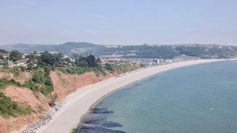 Flying parallel to the beautiful beach of Seaton in east Devon in England. 
The Stock Footage 92769489