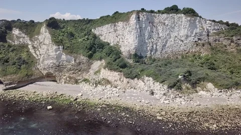 Flying parallel to the Rock formation of the Seaton beach in eastern Devon, Stock Footage 92767266