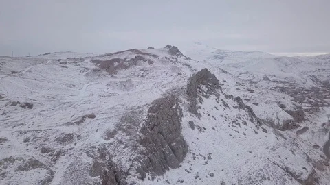 Flying pass over snowy mountains Stock Footage 102634257
