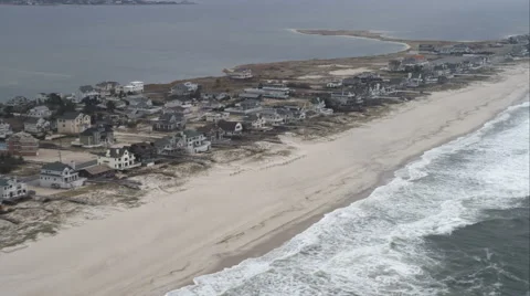 Flying past beachfront homes in West Hampton Dunes on Long Island, New York. Stock Footage 59173137