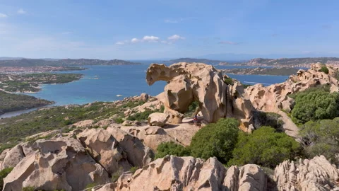 Flying past a bear rock formation Roccia dell’Orso on top of a hill in Sardinia Video stock 270159109