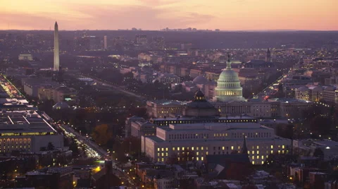 Flying past Capitol Hill and Library of Congress  at dusk, crossing Pennsylvania Stock Footage 59191072