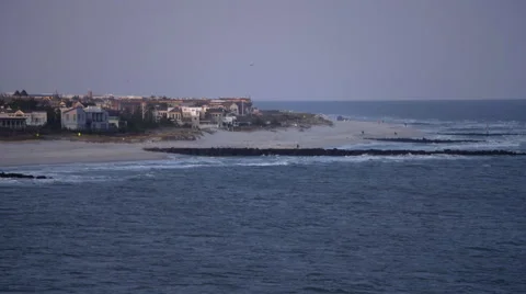 Flying past city of Beach Haven on Long Beach Island, New Jersey at dusk. Shot Stock Footage 59220109