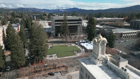 Flying past clocktower towards courthouse square in Santa Rosa CA Stock Footage 224467471