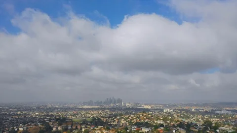 Flying past down town Los Angeles with haze and clouds. Stock Footage 99058692
