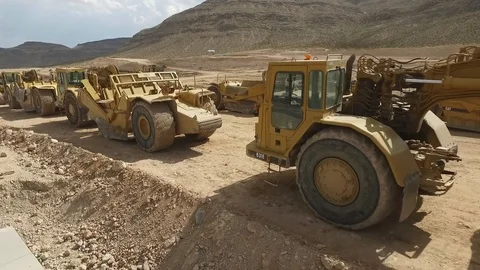 Flying past heavy construction equipment Stock Footage 88568032