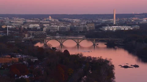 Flying past the Key Bridge over the Potomac River at dusk in Washington DC; left Stock Footage 59187773
