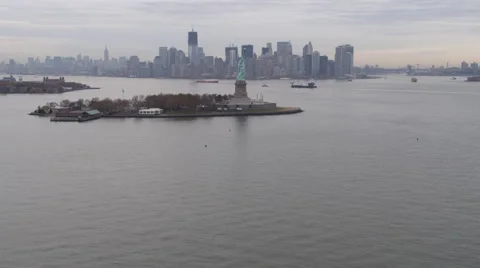 Flying past Liberty Island toward Manhattan skyline in background. Shot in 2011. Stock Footage 59164897