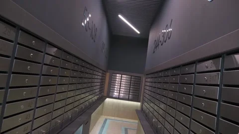 Flying past mailboxes in the entrance of a multi-story building Stock Footage 321004505