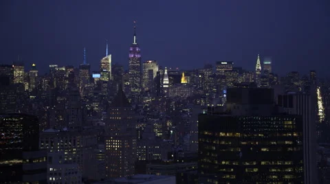 Flying past Manhattan at night looking back at Midtown skyline, Empire State Stock Footage 59171619