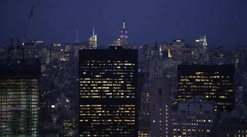 Flying past Manhattan at night, looking back at Midtown; Empire State Building Stock Footage 59530060