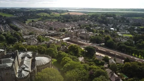 Flying past medieval castle towards rail station, England Stock-Footage 159706653