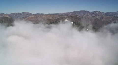 Flying past Mount Wilson Observatory in the rugged San Gabriel Mountains of Stock Footage 59113804