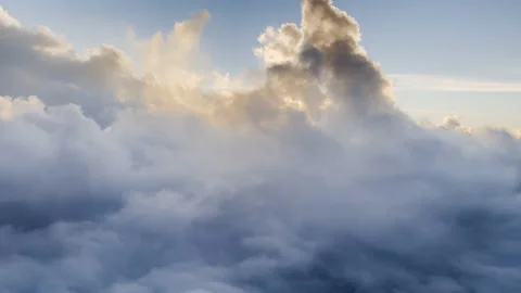 Flying past mysterious evening clouds Stock Footage 168271060