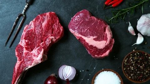 Flying piece of raw beef steak Stock Footage 123549078