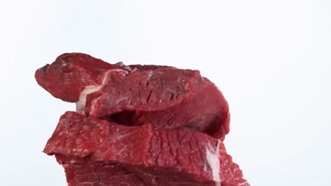 Flying piece of raw beef steaks hitting up in the air Stock Footage 139805821