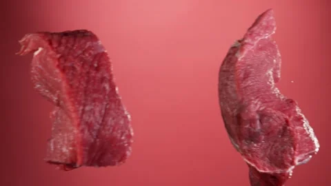 Flying piece of raw beef steaks hitting up in the air Stock Footage 139807674