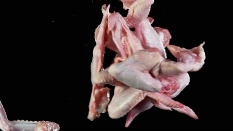 Flying piece of raw chicken wings hitting up in the air. Stock Footage 139801644