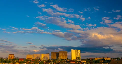 Flying pink clouds at sunset over the town landscape Stock Footage 138444308