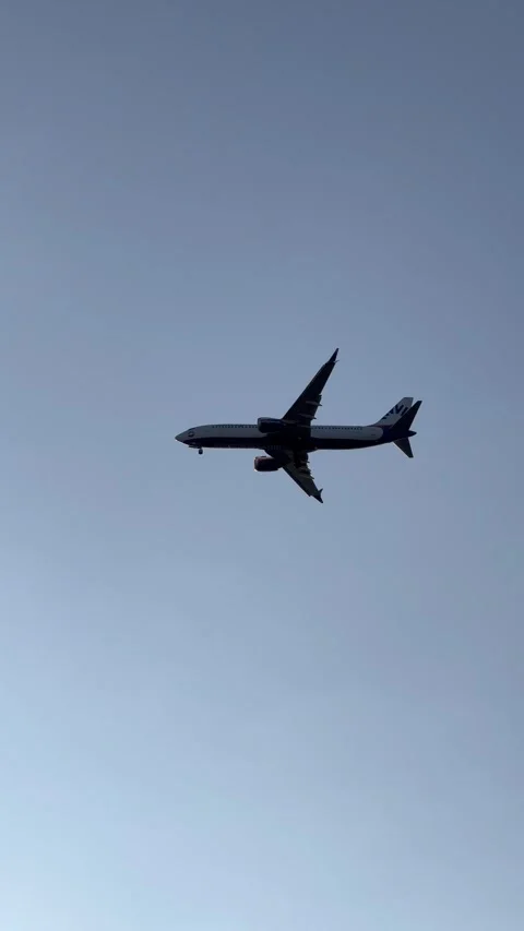 Flying plane in blue sky Stock Footage 336997878