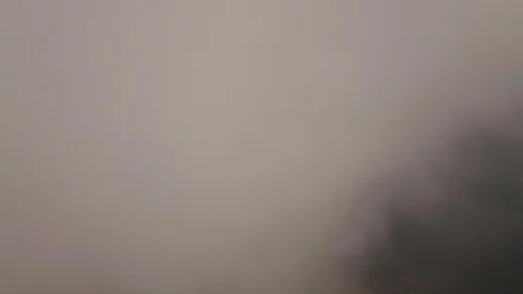 Flying in a plane in the middle of the clouds, the landscape is visible. Stock Footage 107829385