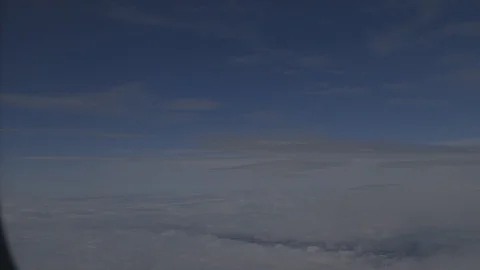 Flying Plane Over Clouds and Blue Sky Stock Footage 117053527