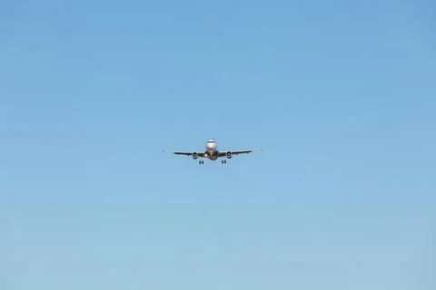 Flying Plane in the sky Stock Photos