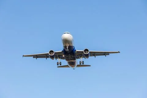 Flying Plane in the sky Stock Photos