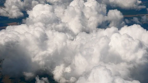 Flying in a plane through the fluffy, snow-white clouds. Spectacular view from 動画素材 126361336