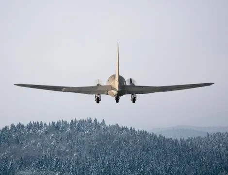 Flying plane in winter Stock Photos