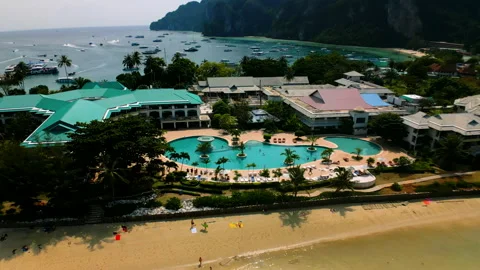 Flying to the pool against the background of the sea and the mountains Stock Footage 232237014