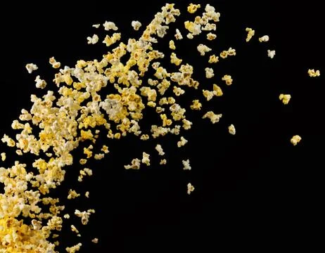 Flying popcorn or wave from it isolated on black background 스톡 사진
