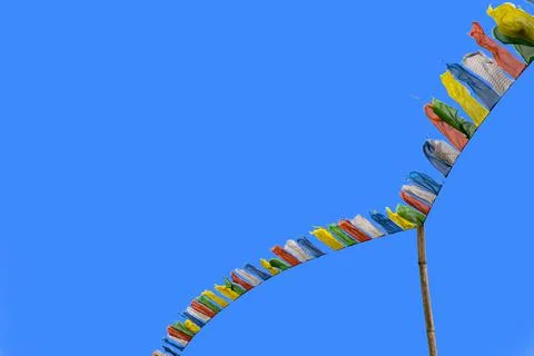 Flying prayer flag of many - colored Stock Photos